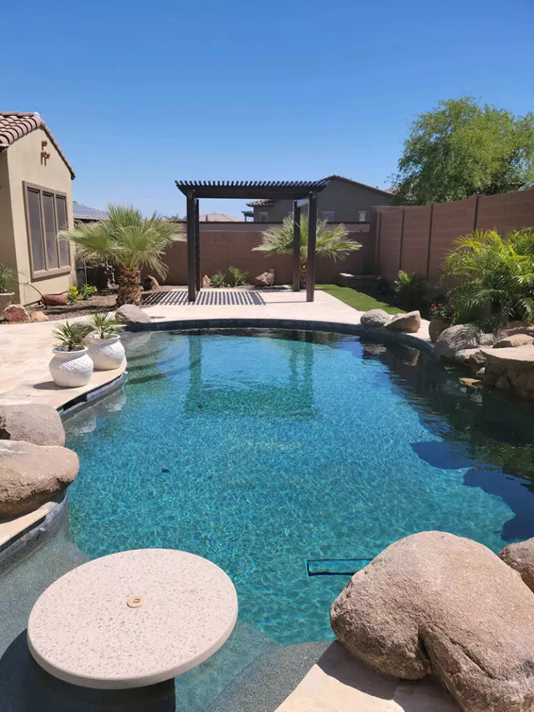 brown aluminawood pergola next to pool