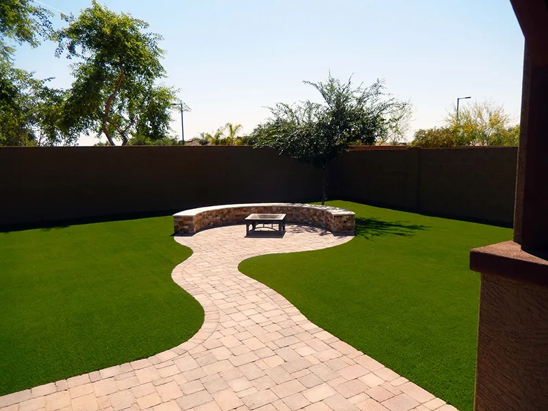 pavers lending to custom paver sitting area with fire pit