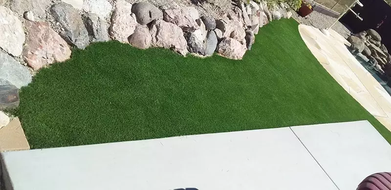 artificial grass inlay around rock