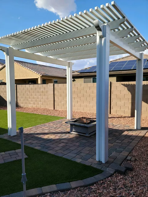 backyard pergola with paver pad